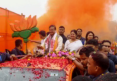 Assam Chief Minister Himanta Biswa Sarma takes part in a rally en route to file nomination for the Jalukbari constituency ahead of the Assam Assembly elections, in Guwahati, Friday, March 20, 2026.