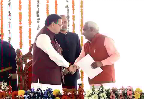 Chief Minister Pushkar Singh Dhami congratulating newly appointed cabinet minister
Madan Singh Kaushik in the Uttarakhand cabinet.