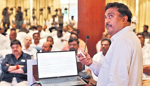 Water resources expert Sriram Vedire gives a PowerPoint presentation on Musi project during an event organised by the BJP on Sunday.