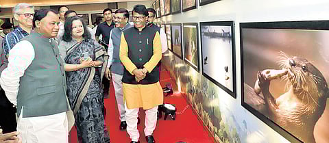 Chief Minister Mohan Charan Majhi going round the photo exhibition organised on the occasion of World Forest Day at the Lok Seva Bhawan Convention centre, in Bhubaneswar on Saturday.