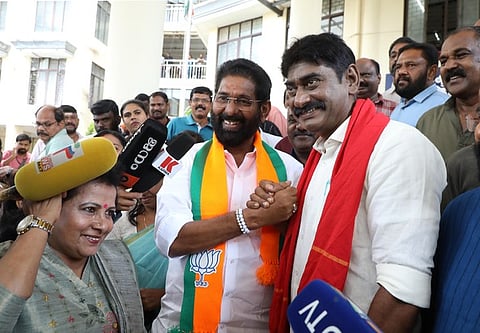 Kanarama Jayan, BJP candidate for Thiruvananthapuram Central, shares a handshake with Sudeer Karamana, LDF candidate for the same constituency