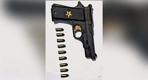 Gun and bullets seized from the accused.