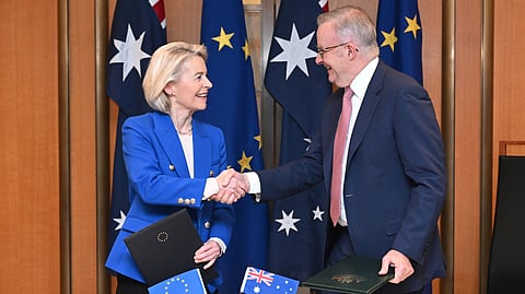 European Commission President Ursula von der Leyen, left, and Australian Prime Minister Anthony Albanese shake hands after signing a joint statement during a ceremony at Parliament House in Canberra, Tuesday, March 24, 2026. 