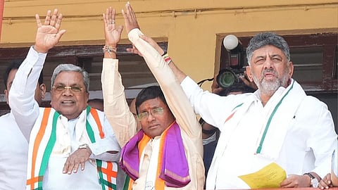 Congress candidate for Bagalkot bypoll Umesh Meti flanked by CM Siddaramaiah and DCM DK Shivakumar after filing his papers on Monday.