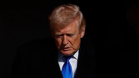 President Donald Trump disembarks Air Force One upon his arrival at Joint Base Andrews, Md., Monday, March 23, 2026.