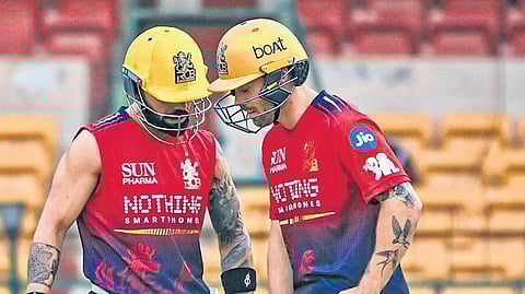 Royal Challengers Bengaluru (RCB) batters Virat Kohli and Phil Salt during a practice session at Chinnaswamy Stadium in Bengaluru.