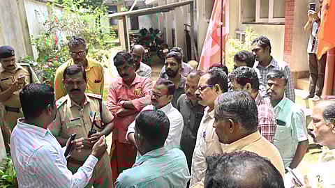 Workers stage a protest in front of the Vijayamohini Mills on Wednesday by blocking the entry of the company management.