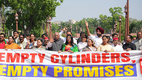 LoP in the Rajya Sabha and Congress leader Mallikarjun Kharge, DMK MP Thamizhachi Thangapandian, NCP (SP) MP Supriya Sule, Samajwadi Party MP Dharmendra Yadav and other opposition leaders stage a protest over the LPG crisis during the second part of the Budget Session of the Parliament, in New Delhi, Wednesday, March 25, 2026.