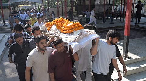 Family members carry the mortal remains of Harish Rana, the first person in India to be allowed passive euthanasia, during his last rites at Green Park Cremation Ground in New Delhi, Wednesday, March 25, 2026.