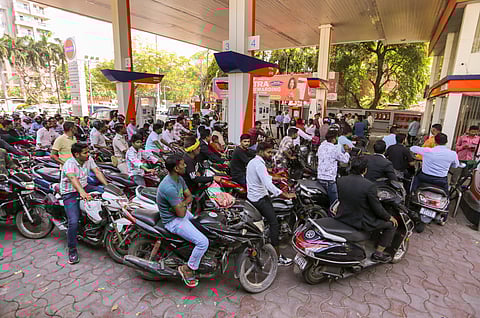 People queue up at a petrol pump amid rumours of fuel shortage in the wake of the West Asian conflict, in Prayagraj, Uttar Pradesh, Thursday, March 26, 2026. 