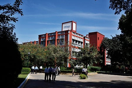 Infosys Technologies Ltd. employees walk inside the company's headquarters in Bengaluru 
