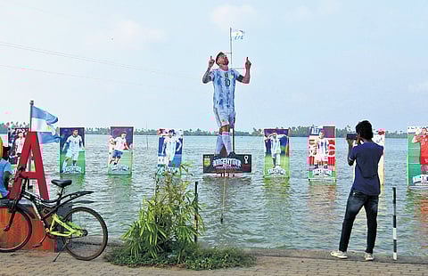 A cutout of Lionel Messi team erected in the backwaters 
of Neendakara during the 2022 FIFA World Cup