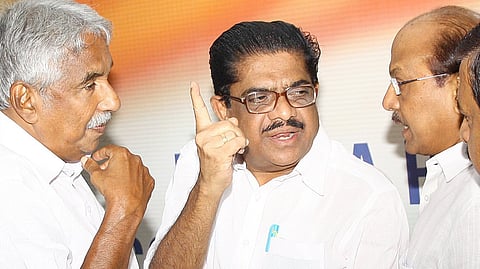 Former Chief minister Oommen Chandy and Home minister Ramesh Chennithala discusses a point,while KPCC president V M Sudheeran,Industries Minister P K Kunjalikutty and former minister K M Mani look on.