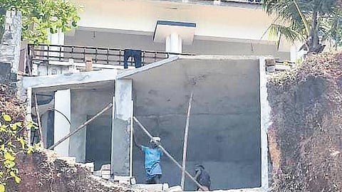 Unauthorised construction being carried out causing destruction to the Varkala cliff near the Balimandapam, Papanasam in Varkala