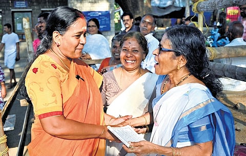 NDA candidate Sobha Surendran interacts with devotees at the Sree Anjaneya Swamy temple near the Palakkad Fort on Thursday morning