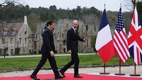 France's Foreign Affairs Minister Jean-Noel Barrot, right, greets U.S. Secretary of State Marco Rubio as he arrives at the G7 Foreign Ministers' meeting with partner countries in Cernay-la-Ville outside Paris, France, Friday, March 27, 2026. 