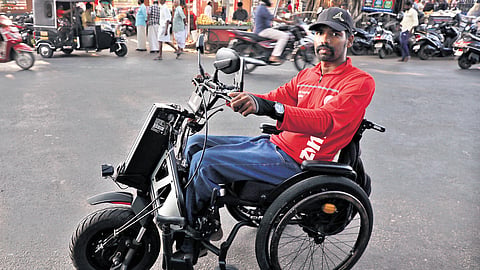Online food delivery partner Ratheesh Kumar on his mobility scooter 