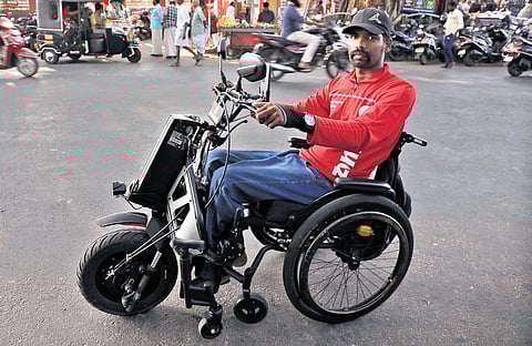 Online food delivery partner Ratheesh Kumar on his mobility scooter 