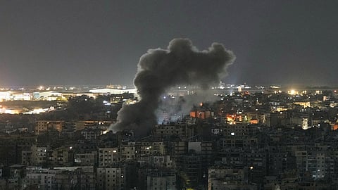 Smoke rises from a building following an Israeli airstrike in Dahiyeh, Beirut's southern suburbs, Lebanon, Friday, March 27, 2026.