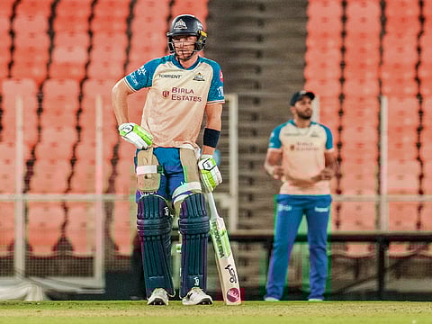 Jos Buttler during practice (L)