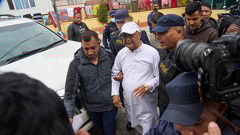 Former Prime Minister Khadga Prasad Sharma Oli is taken for a procedural medical checkup after he was arrested by police in Kathmandu, Nepal, on Saturday, March 28, 2026.