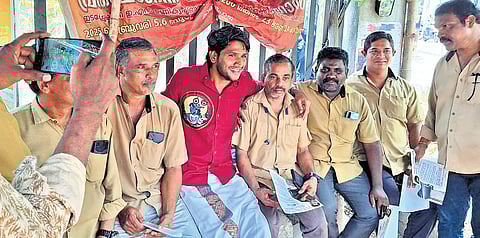 Twenty20 candidate for Thrikkakara Akhil Marar interacting with autorickshaw drivers near the Cochin Special Economic Zone in Kakkanad
