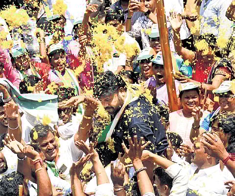 MLA Pradeep Eshwar campaigns for Samarth Shamanur in Davanagere on Saturday. 
