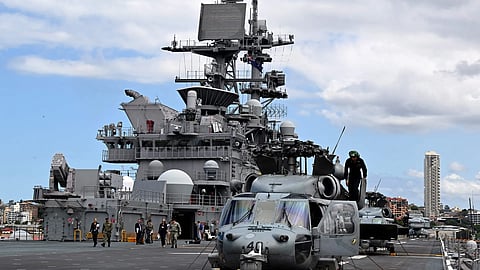 The USS Tripoli during a port call as part of routine operations in the Indo-Pacific in 2022. The deployment could add thousands of marines, several warships and F-35 jets in the region
