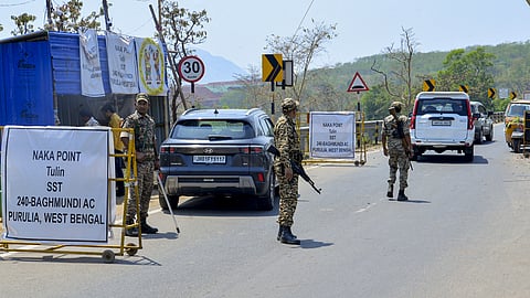 Central Reserve Police Force (CRPF) personnel checking vehicles ahead of the West Bengal Assembly elections.