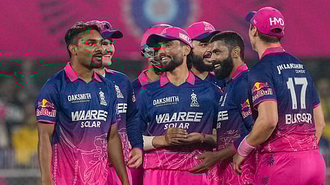 Rajasthan Royals' Ravindra Jadeja, second right, celebrates with teammates after taking the wicket of Chennai Super Kings' Shivam Dube during an Indian Premier League (IPL) 2026 T20 cricket match between Rajasthan Royals and Chennai Super Kings, at ACA Stadium, Barsapara, in Guwahati. 