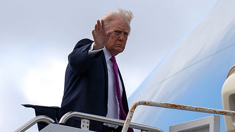 
President Donald Trump waves as he boards Air Force One, Sunday, March 29, 2026, at Palm Beach International Airport in West Palm Beach, Fla.