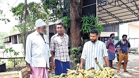 Residents of Vengara in Malappuram engaging in election discussions 
with a trader 