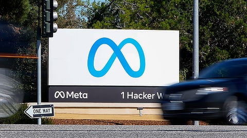 A car passes Facebook's new Meta logo on a sign at the company headquarters on Oct. 28, 2021, in Menlo Park, California. 