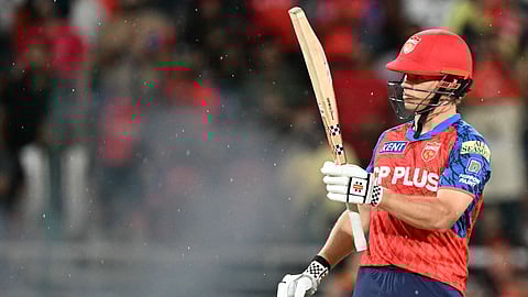 Punjab Kings' Cooper Connolly celebrates after scoring a half-century during the 2026 IPL T20 match between Punjab Kings and Gujarat Titans at the Maharaja Yadavindra Singh International Cricket Stadium on the outskirts of Chandigarh on March 31, 2026.