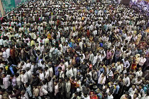 Indians crowd ticket counters at a railway station in Ahmadabad.