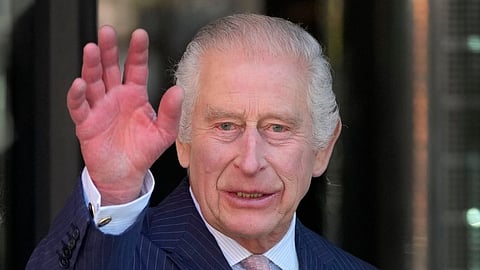 Britain's King Charles III waves as he arrives for a visit to University College Hospital Macmillan Cancer Centre in London, Tuesday, April 30, 2024.