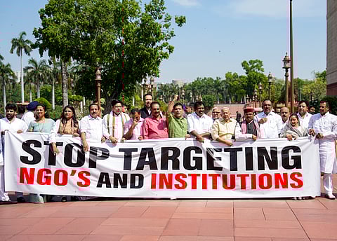Opposition MPs Hibi Eden, Prashant Padole, Dean Kuriakose, Supriya Sule, and others, stage a protest during the second part of the Budget session of Parliament, in New Delhi, Wednesday, April 1, 2026. 