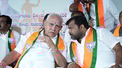 BJP leader BS Yediyurappa with party candidate Srinivas Daskariyappa during campaigning in Davanagere on Tuesday.