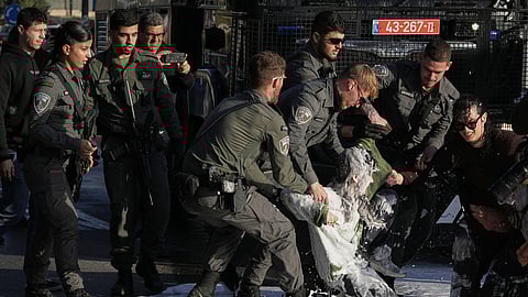Police disperse demonstrators during a protest against the decision by Israel's parliament to approve the death penalty for Palestinians convicted of murdering Israelis, in Jerusalem Tuesday, March 31, 2026.