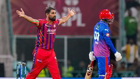 Mohammed Shami (l) celebrates the wicket on Wednesday