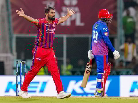 Mohammed Shami (l) celebrates the wicket on Wednesday