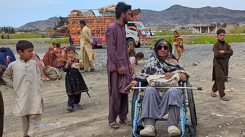Afghan refugees gather next to a truck loaded with their family's belonging as they wait for registration to leave for their homeland, outside a repatriation centre in Landi Kotal, a town of Pakistan's Khyber district bordering with Afghanistan, Wednesday, April 1, 2026.