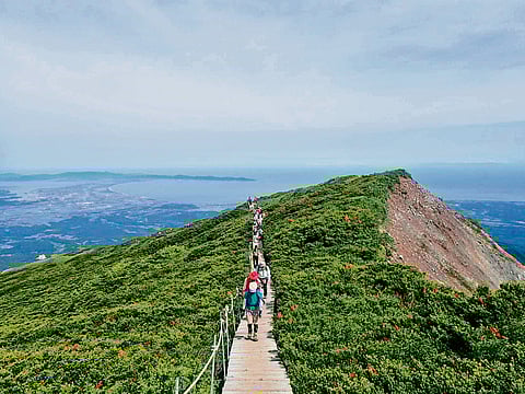 Tourists trekking Mount Daisen