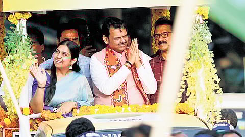 Maharashtra CM Devendra Fadnavis during a roadshow with Sabu M Jacob and Twenty20 candidate Anjali Nair in Kochi.