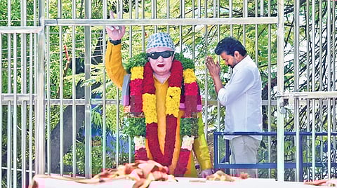 TVK leader Vijay garlanding and paying respects to the statue of former AIADMK supremo MGR at Marakkadai, Tiruchy, on Thursday 