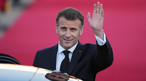 French President Emmanuel Macron waves upon his arrival at the Seoul airport in Seongnam, South Korea, Thursday, April 2, 2026.