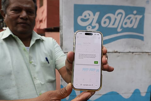 Aavin Coimbatore, customer displays an error "Aavin cbe" application at Aavin milk booth in Coimbatore on Friday. 