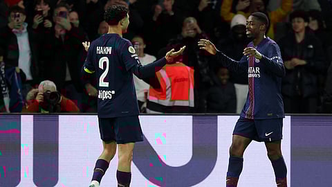 PSG's Ousmane Dembele (R) celebrates with tammate Achraf Hakimi after scoring his team's first goal during the French L1 football match between Paris Saint-Germain and Toulouse FC on April 3, 2026.