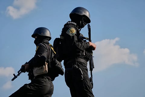 Iranian police special forces stand guard during a funeral procession for Alireza Tangsiri, head of Iran's Islamic Revolutionary Guard Corps Navy, and others killed in Israeli strikes in late March, in Tehran, Iran, Wednesday, April 1, 2026.