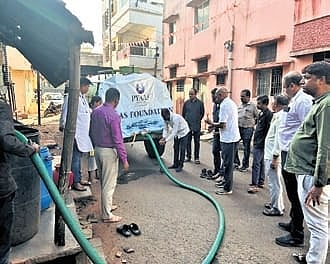 Members of Pyaas Foundation supply drinking water at Gajapati village in Belagavi district